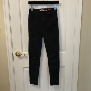 Celebrity Pink size 1, high waisted black stretchy jean with holes at the knees!